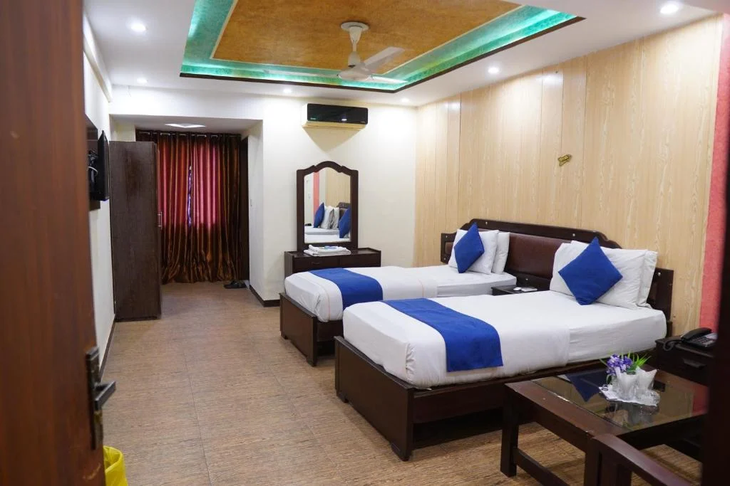 Deluxe twin room for business and family stays at National Hotel Lahore