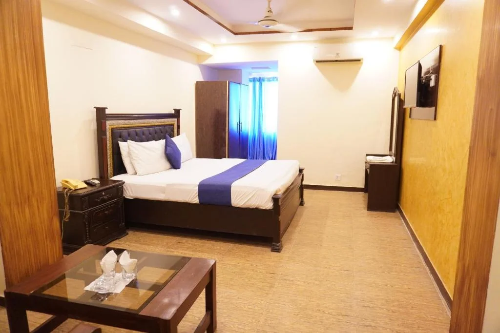 Family double room with attached bathroom at hotel on Abbott Road Lahore